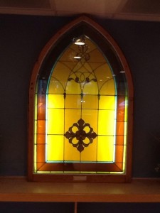 This stained glass window is from Westwood Baptist Church, built in 1895 (the predecessor to Faith Fellowship).